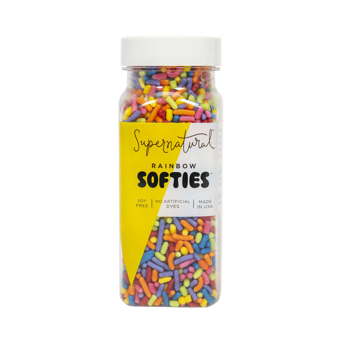 A clear plastic bottle of Supernatural Rainbow Softies Sprinkle, colorful vegan sprinkles that are soy-free, allergen-friendly, made in the USA, and contain no artificial dyes.