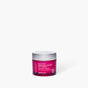 A small, translucent magenta jar of Andalou 1000 Roses Biome Balancing Day Cream with a silver lid.