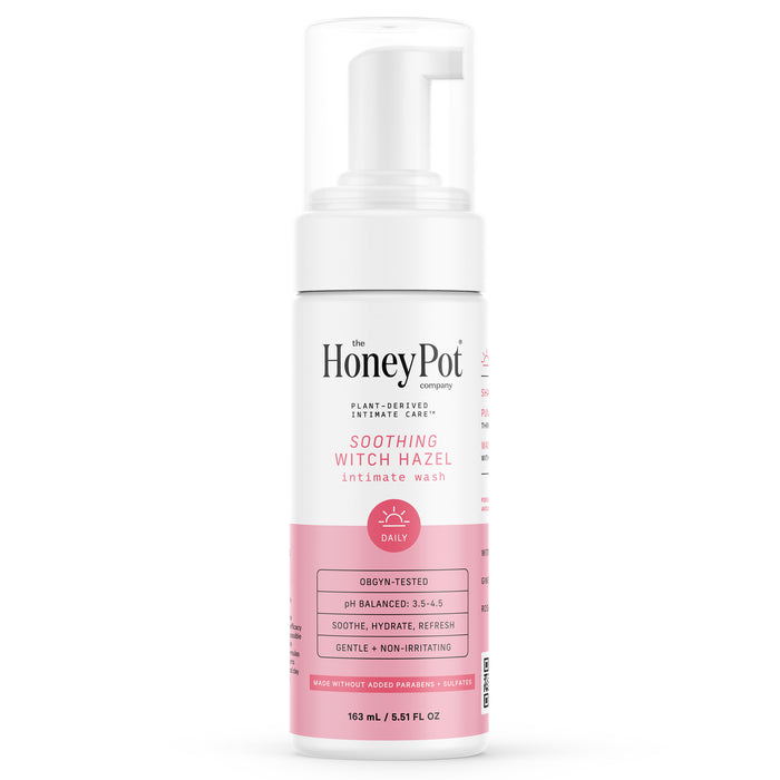A white bottle of The Honeypot Company’s Soothing Witch Hazel Intimate Wash with a pink label, foam pump, and info highlighting gentle, plant-derived care for healthy vaginal pH.