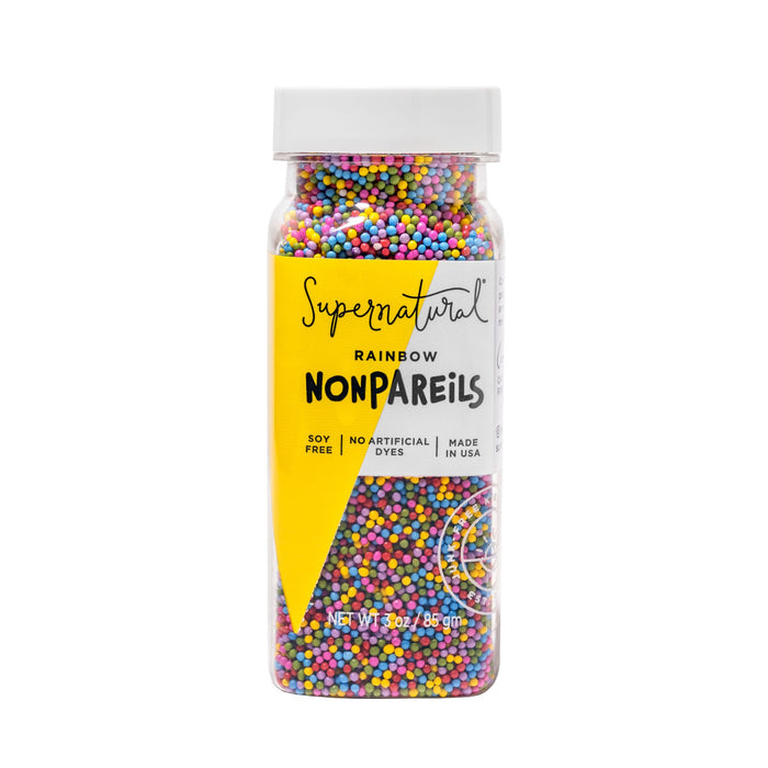 Supernatural Rainbow Nonpareils Sprinkle comes in a clear plastic bottle with a yellow label. These plant-based, vegan-friendly sprinkles are soy-free, made without artificial dyes, and produced in the USA—ideal for colorful decorating.