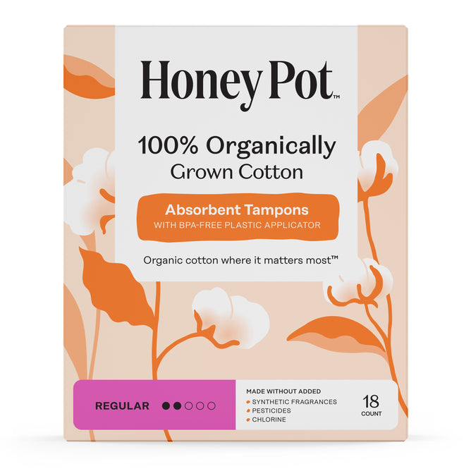 The Honeypot Company 100% Organic Regular Tampons come in a box of 18 unscented tampons, featuring orange and white cotton plant designs. Made from organically grown cotton, they provide reliable leak protection.