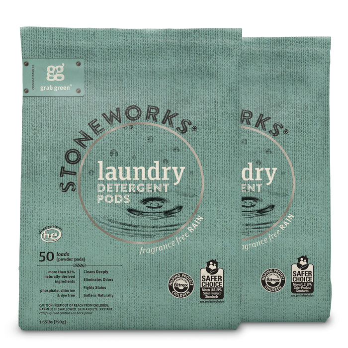 Two green bags of grab greens Stoneworks Laundry Detergent Pods - Rain are showcased, featuring a fragrance-free formula for 50 loads each. The labels highlight EPA Safer Choice Certification for deep cleaning and odor elimination.