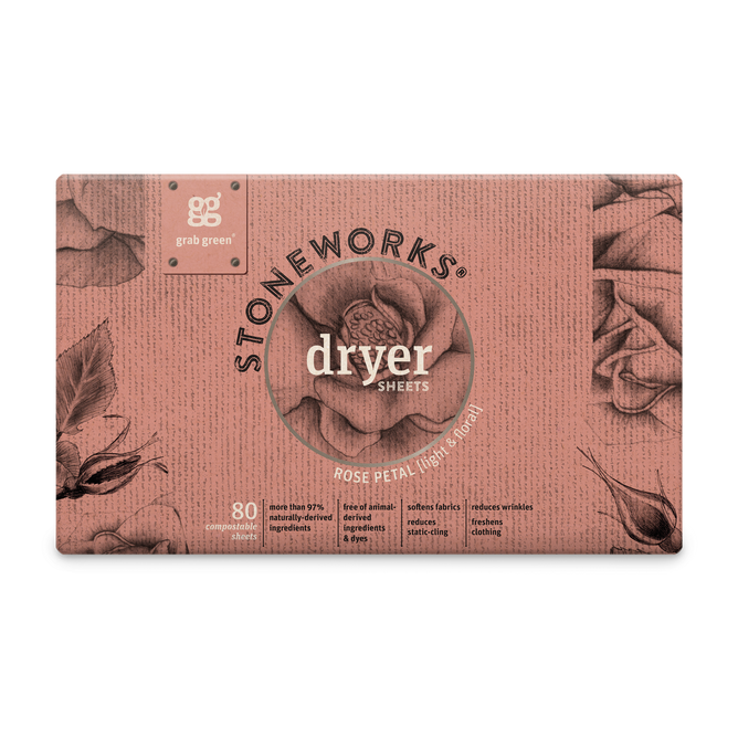 The Stoneworks Dryer Sheets - Rose Petal by grab green come in a pink box with floral illustrations and metallic accents. Made from recycled paper, the packaging contains 80 sheets and highlights benefits like static cling reduction and fabric softening.