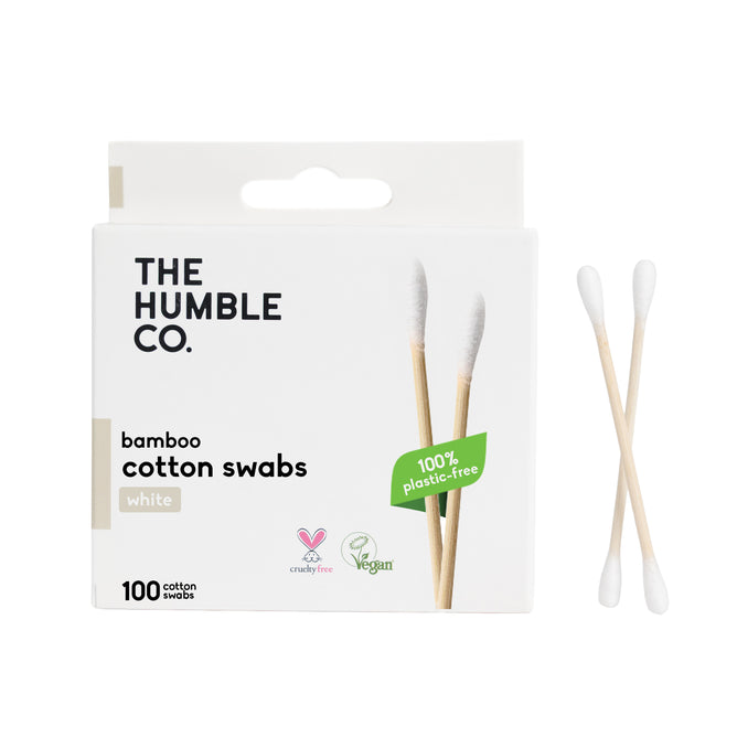 A box of The Humble Co. Cotton Swabs - White, featuring 100 bamboo swabs that are 100% plastic-free, cruelty-free, and vegan. Two swabs are displayed beside the box—perfect for precision touchups.