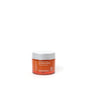 A small orange jar of Andalou Naturals Brightening Pumpkin Honey Glycolic Mask with a white lid, featuring pumpkin enzyme and glycolic acid, is centered on a white background.