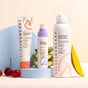 Solara Suncare’s Go! Mineral Defense Sport: Antioxidant Face Screen SPF 50 is shown on a pastel background with a blue arch, cherries, green leaves, and a mango slice, highlighting natural ingredients and broad-spectrum protection.