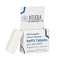 A box labeled Meliora All-Purpose Home Cleaner Refill Tablets with one white ultra-concentrated tablet leaning against it; the box indicates that the product is fragrance-free and dye-free.