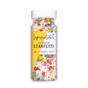 A clear plastic bottle labeled Supernatural Rainbow Starfetti Sprinkle, filled with colorful star-shaped vegan sprinkles made in the USA, featuring plant-based colors, no artificial colors, and soy-free.