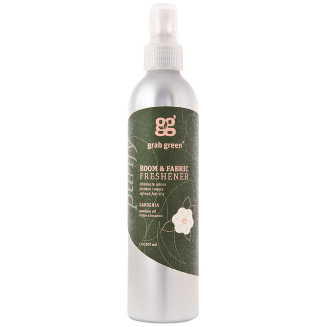 The Grab Green Room and Fabric Freshener - Gardenia features an elegant silver spray bottle with a green label, adorned with white text and a flower graphic. Infused with gardenia scent and essential oils, this 7 fl oz (207 ml) phthalate-free formula naturally neutralizes odors.