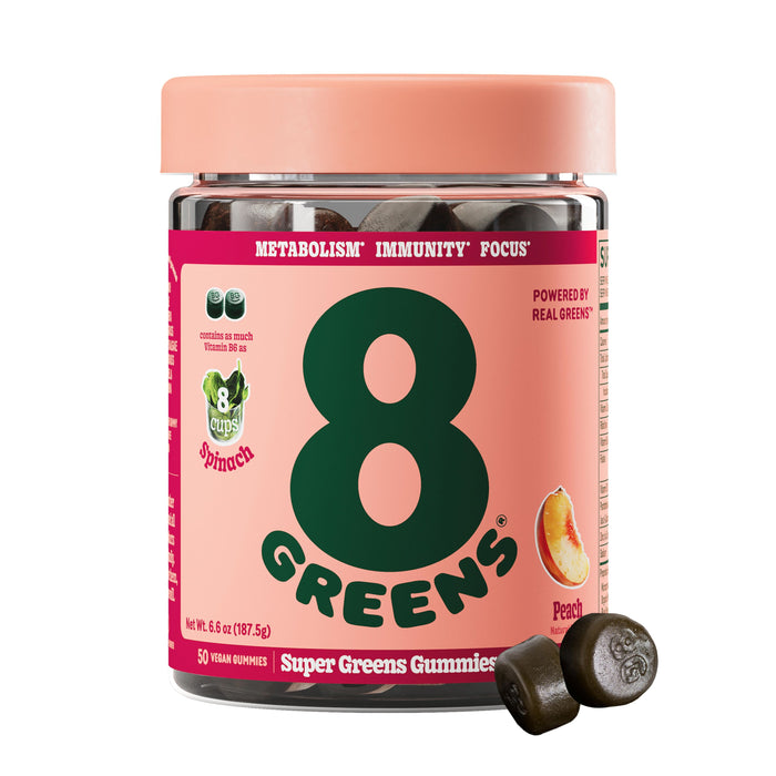 A jar of 8Greens Super Greens Gummies - Peach features immune and metabolism support. Each jar contains 50 vegan gummies, with each serving equaling 8 cups of spinach. Two gummies are placed in front, ready to enhance your wellness journey.