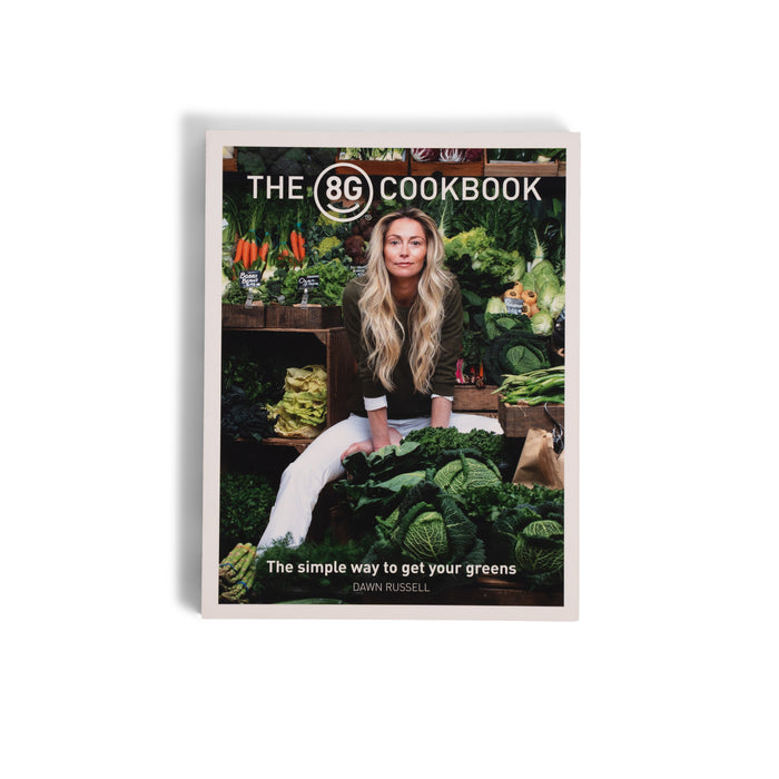 The 8Greens Cookbook by Dawn Russell from 8Greens features a woman with long blond hair surrounded by green vegetables on the cover, highlighting nutrition. The tagline says: The simple way to get your greens.