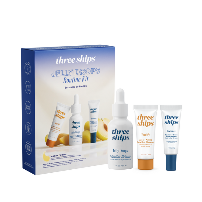 The Three Ships Jelly Drops Routine Kit features a box and three products—Jelly Drops serum, Purify cleanser, and Radiance cream—arranged upright on a white background for a complete skincare routine.
