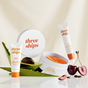 Three Ships’ Bright Side: Brightening Eye Routine Kit, featuring brightening eye cream and eye masks, is shown with aloe leaves and cherries on a white surface.