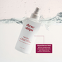 A Three Ships Take Five™ Balancing Body + Face Spray – Hypochlorous Acid bottle is shown partially submerged in water, with its label emphasizing hypochlorous acid as a natural antibacterial agent that soothes and calms the skin. Marketed as nature’s disinfectant, this pH-balanced spray by Three Ships is ideal for gentle, everyday use on both face and body.