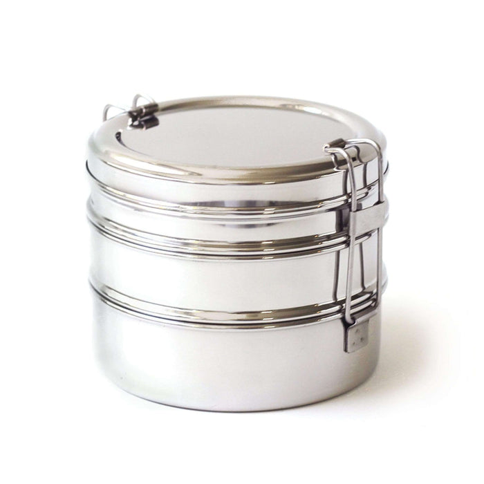 The EcoLunchBox Tri Bento Stainless Steel Lunchbox, featuring three neatly stacked tiers with secure side clasps, is an eco-friendly lunch container shown against a white background.