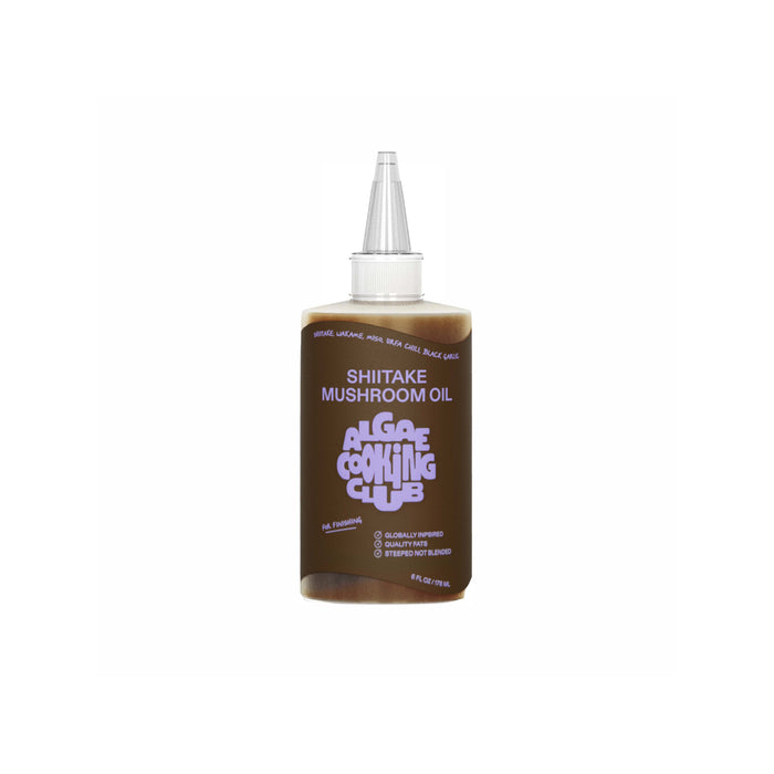 The Shiitake Mushroom Oil by Algae Cooking Club features purple text on a brown background and includes a pointed cap for easy dispensing.