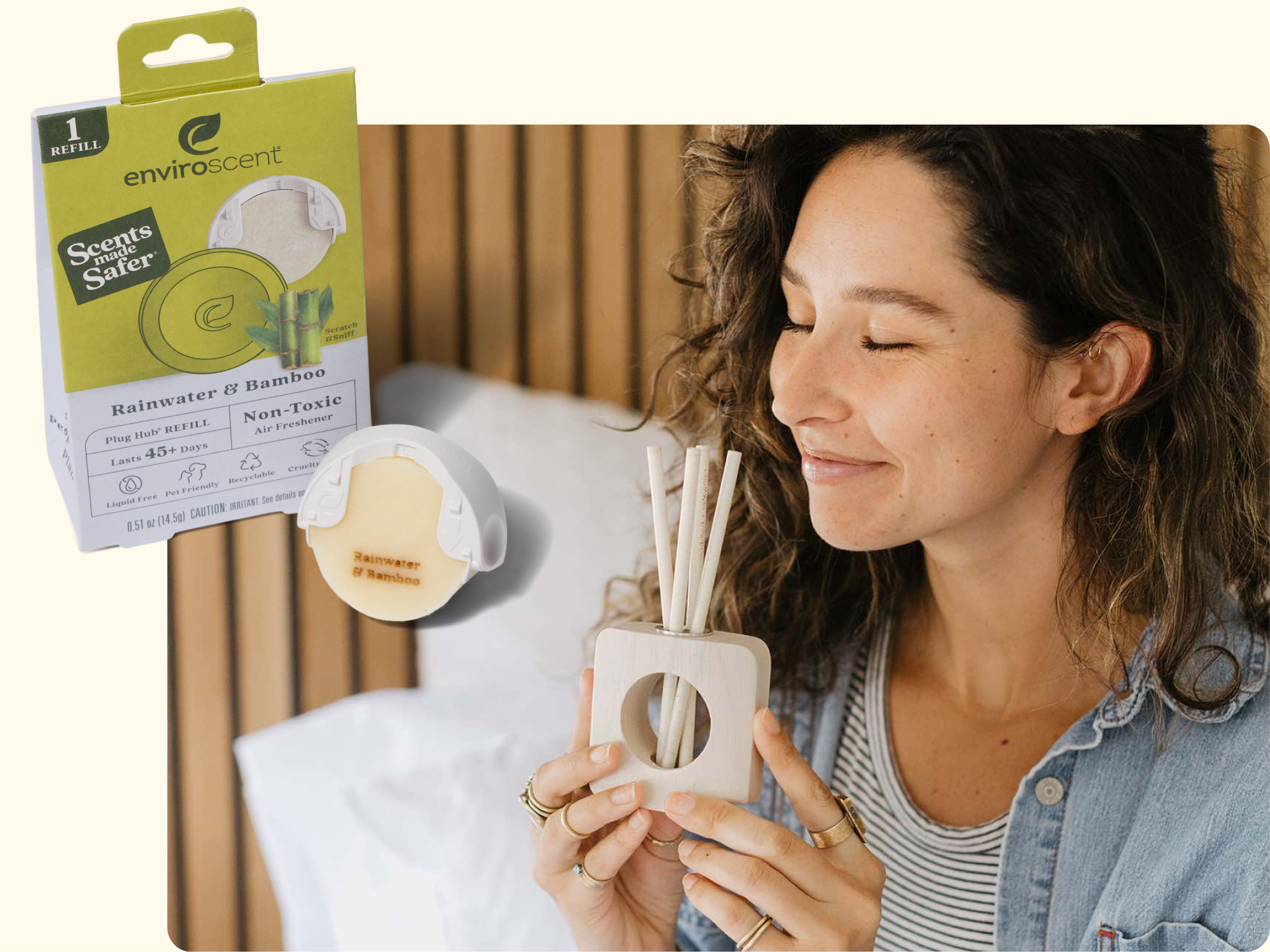 A woman with wavy brown hair smiles with her eyes closed, holding a wooden air freshener with scent sticks. An Enviroscent Rainwater & Bamboo air freshener product box is shown in the upper left corner.