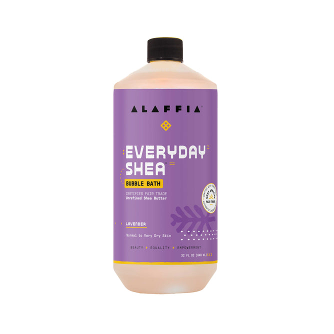 A 32 fl oz bottle of Alaffia EveryDay Shea Bubble Bath in lavender scent features a rich, sulfate-free formula with fair trade shea butter and soothing lavender oil—ideal for normal to very dry skin. The packaging has a purple label with white and yellow text, topped with a black cap.