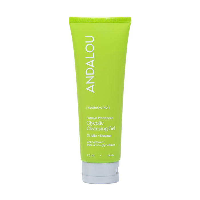 A green tube of Andalou Naturals Resurfacing Glycolic Cleansing Gel with white text, standing upright against a white background. This cleansing gel gently exfoliates to boost radiance for a fresh, glowing complexion.
