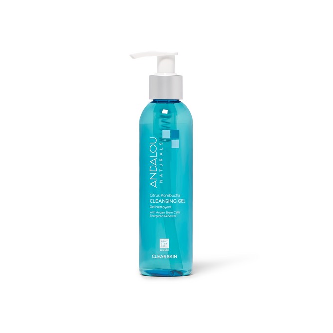 A clear blue bottle with a white pump labeled “Andalou Naturals Clear Skin Citrus Kombucha Cleansing Gel” for blemish-prone skin, featuring fruit stem cell complex. Contains 6 fl oz (178 ml) and stands upright on a white background.