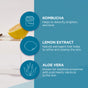 A graphic features illustrations and text listing benefits of kombucha, lemon extract, and aloe vera for blemish-prone skin on a blue background, with a lemon half and Andalou Naturals Clear Skin Citrus Kombucha Cleansing Gel container partially visible.