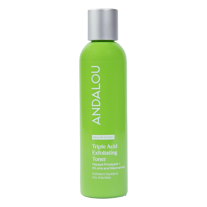A vibrant green bottle of Andalou Naturals Resurfacing Triple Acid Exfoliating Toner with a silver cap, featuring white text and product details on the front label. This potent liquid exfoliant is formulated to help minimize pores and promote radiant skin.