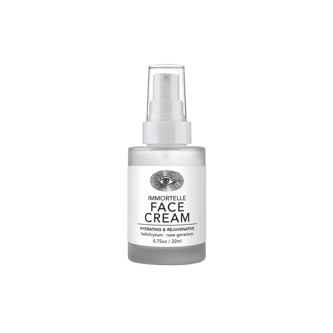 A clear bottle of Anima Mundi IMMORTELLE Face Cream with pump dispenser and a white label featuring an illustrated eye. Label text: IMMORTELLE Face Cream, Hydrating + Rejuvenative*, 0.75oz / 22ml.