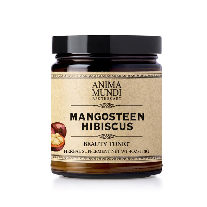 A dark glass jar labeled Anima Mundi MANGOSTEEN HIBISCUS Beauty Tonic, an herbal supplement with mangosteen and hibiscus powder for organic vitamin C. Net wt. 4 oz (113g), illustrated with mangosteen and hibiscus flowers.