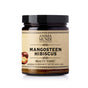 A dark glass jar labeled Anima Mundi MANGOSTEEN HIBISCUS Beauty Tonic, an herbal supplement with mangosteen and hibiscus powder for organic vitamin C. Net wt. 4 oz (113g), illustrated with mangosteen and hibiscus flowers.