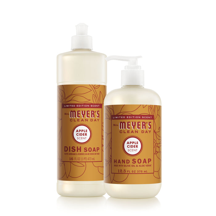 Experience cozy fall scents at your sink with Mrs. Meyer's Fall Hand & Dish Soap Set, featuring limited edition Apple Cider-scented hand and dish soaps in orange and gold labels.