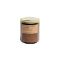 A brown amber jar soy wax candle by P.F. Candle Co., featuring a gold metal lid and a tan label with black text, is hand-poured and displayed on a white background.