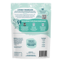 Back of a Shameless Pets “Dog Treats - Apres Ski and Sit” bag with a teal and white design, displaying product information, an ingredient list, nutrition facts, feeding guidelines, cheerful dog graphics, and a map of the USA. Snowflake patterns accent the top. This packaging highlights our grain-free Apres Ski and Sit treats made with real duck for a soft and meaty snack your pup will adore.