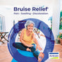A smiling older woman in a yellow tank top stretches on a yoga mat indoors. The text reads, "Bruise Relief* Pain • Swelling • Discoloration." The Boiron logo appears in the bottom right corner alongside the product name, ArnicaBruise 30C Meltaway Pellets + Bonus Pack – Bruise Relief, highlighting the benefits of homeopathic medicine with Arnica 30C.