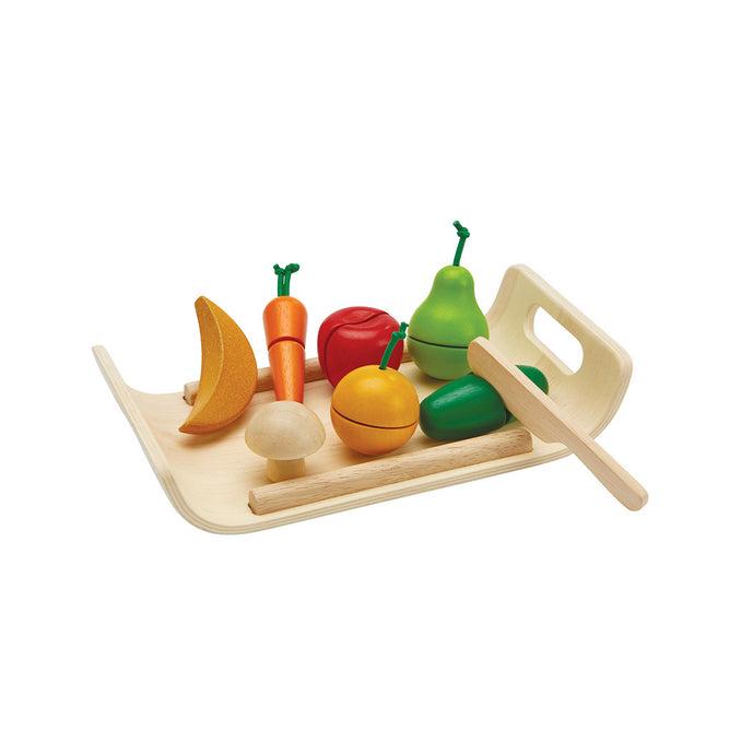 The PlanToys Wooden Assorted Fruit and Vegetable Food Set features colorful wooden pear, carrot, tomato, mushroom, and lemon plus a knife for pretend cutting—ideal for developing fine motor skills during play.