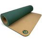 The Aura Cork Yoga Mat by Yoloha Yoga is partially rolled out on a white surface, displaying its comfortable cork surface and a flower logo in one corner, with green cushioning underneath.