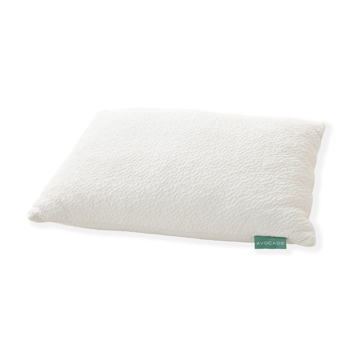 The Avocado Green Pillow in a standard rectangular shape, featuring a white textured organic cover and a green fabric tag, is shown against a plain white background.