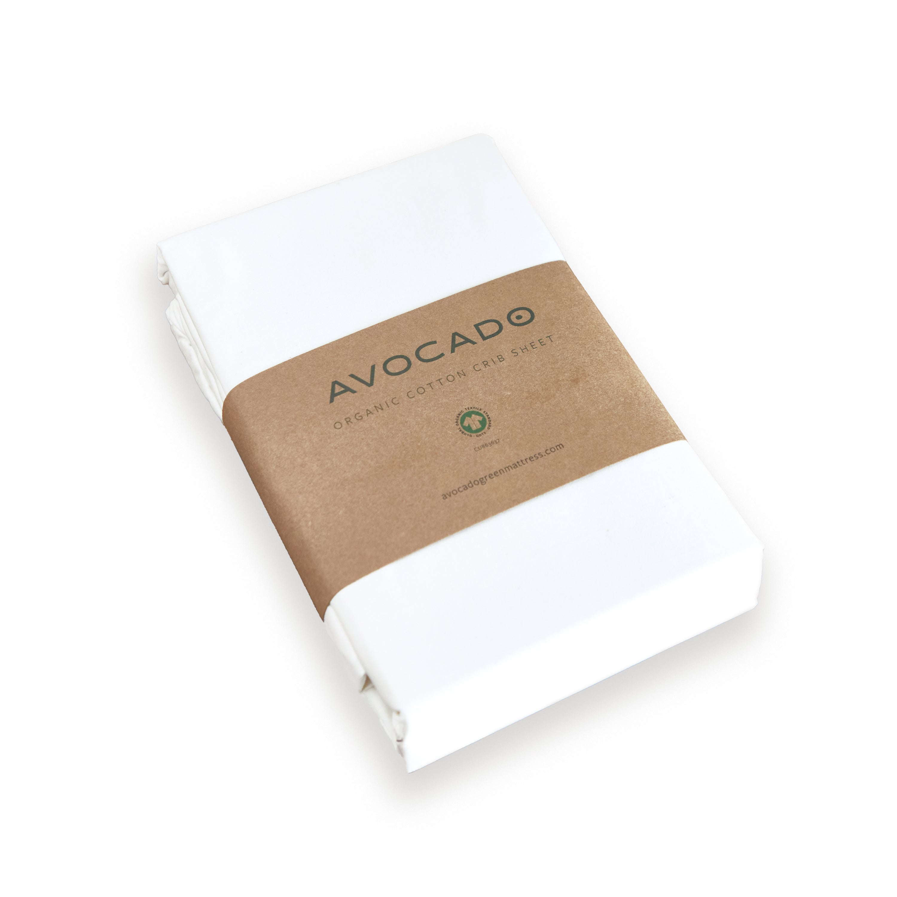 A neatly folded Avocado Organic Cotton Crib Sheet, wrapped with a brown paper band and made from GOTS certified organic cotton, is displayed on a plain white background.