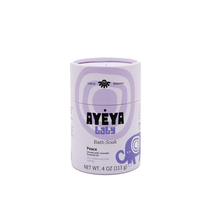 Ayeya Baby Bath Soak comes in a cylindrical container with lavender packaging and an elephant design. The Peace label features calming lavender and shea butter, is gentle for sensitive skin, and has a net weight of 4 oz (113 g).