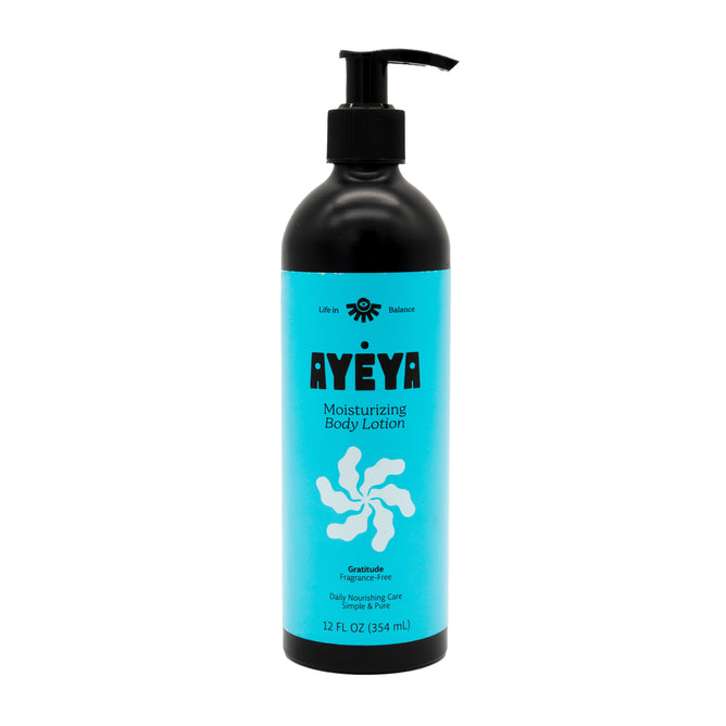 A 12 fl oz (354 ml) black pump bottle of Ayeya Moisturizing Body Lotion with a turquoise label, black and white text, and a white abstract design. This lotion deeply moisturizes to replenish your skin’s needs.
