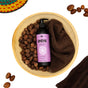 A wooden bowl of shea nuts, a dark towel, and a bottle of Ayeya Moisturizing Body Lotion with a purple label sit among scattered shea nuts and a vibrant woven basket—ideal for nourishing your skin.
