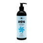A black Ayeya Moisturizing Body Wash bottle with a pump sits on a light blue background, featuring a blue swirl and highlighting its fragrance-free, essential oils formula for soft, hydrated skin.