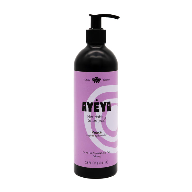 Ayeya Nourishing Shampoo comes in a 12 fl oz (354 mL) black pump bottle with lavender and white design featuring Peace. Made with clean ingredients, this moisturizing formula suits all hair types and is inspired by lavender.