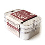 The EcoLunchBox Three-in-One Giant Stainless Steel Lunch Box is a large, non-toxic, plastic-free container with secure metal clasps and a brown and cream paper label.