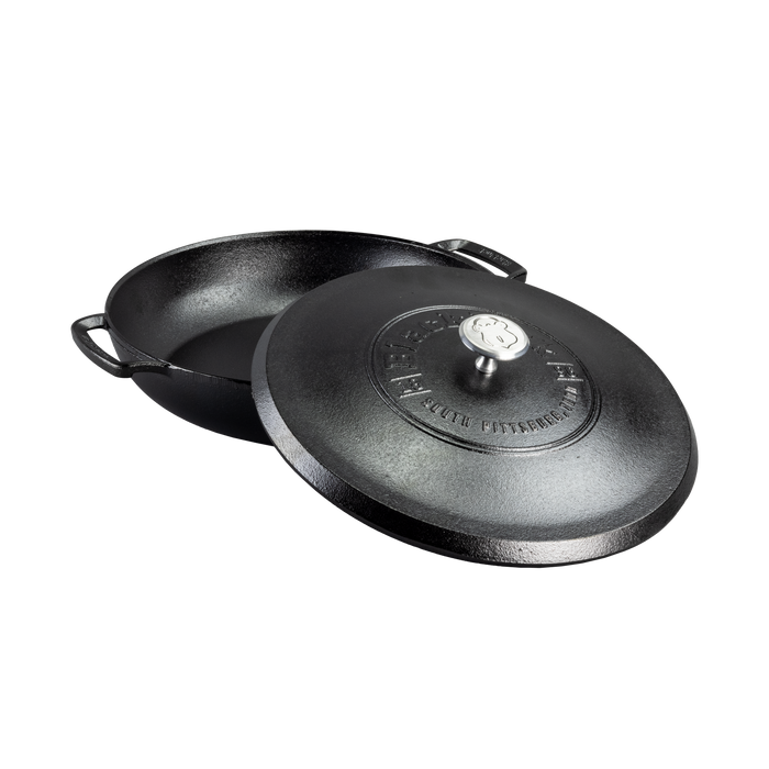 The Lodge Blacklock Cast Iron Braiser with Lid is shown on a white background. This lightweight, triple seasoned, nontoxic cookware in black features two side handles and a matching lid, which is slightly tilted to reveal the interior.
