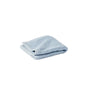 An Air Weight® Organic Towel from Coyuchi in light blue, crafted from organic cotton, is neatly folded and placed on a plain white background.