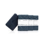 Four dark blue rectangular bars of Oars + Alps Exfoliating Bar Soap are shown, three in patterned wrappers and one unwrapped displaying the brand logo.