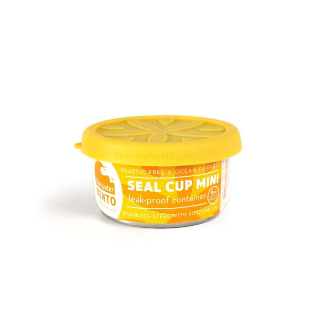 The EcoLunchBox Seal Cup Mini is a small stainless steel food container with an orange and yellow leak-proof silicone lid, displayed on a white background.