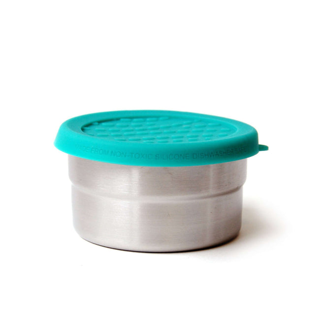 The EcoLunchBox Seal Cup Solo is a small, round, leak-proof stainless steel container with a turquoise textured silicone lid and embossed rim. This plastic-free food container is both stylish and functional, shown on a white background.