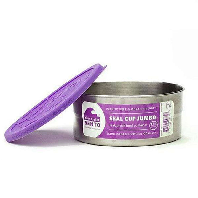 A round EcoLunchBox Seal Cup Jumbo stainless steel container with a purple silicone lid, partially open, is shown. The label promotes it as a leak-proof, plastic-free, and ocean-friendly lunch container.