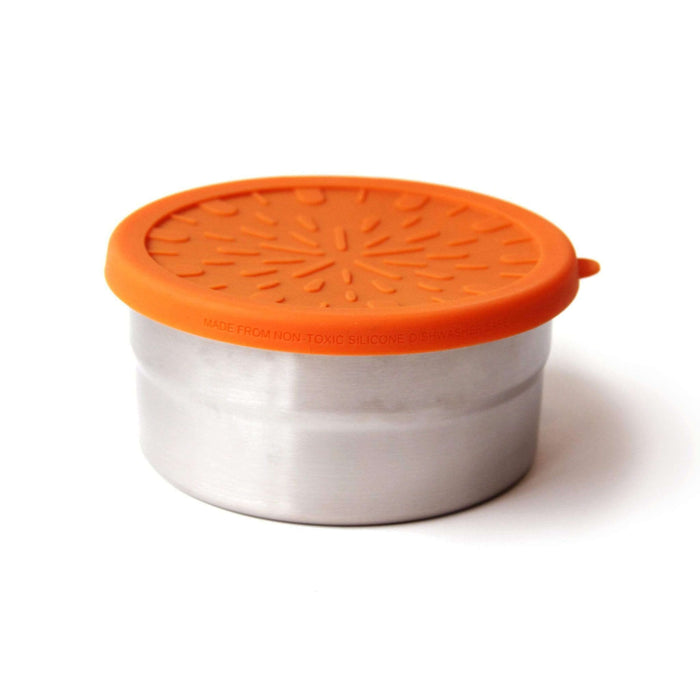 The EcoLunchBox Seal Cup Large is a round metal, plastic-free lunch container with a bright orange patterned silicone lid, displayed against a plain white background.